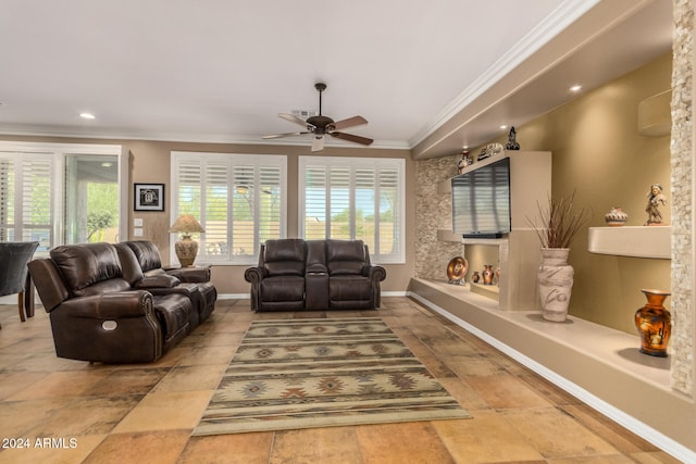 living room featuring ceiling fan and crown molding