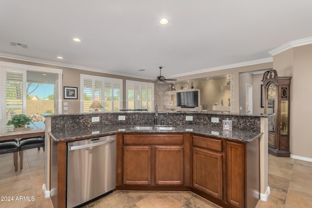 kitchen with dishwasher, a center island with sink, and sink