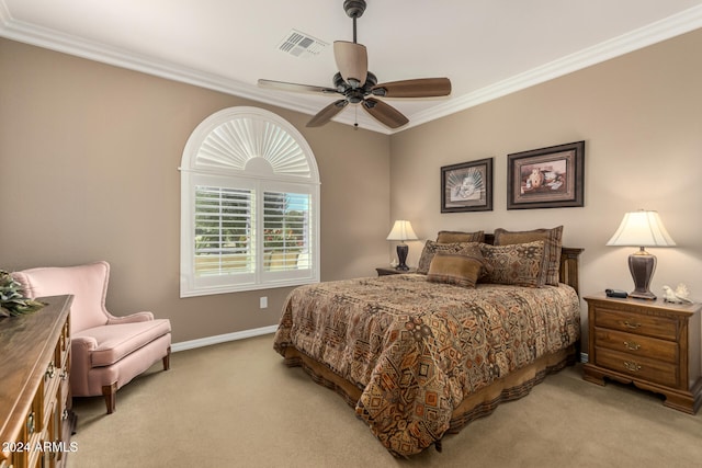 carpeted bedroom featuring ceiling fan and crown molding