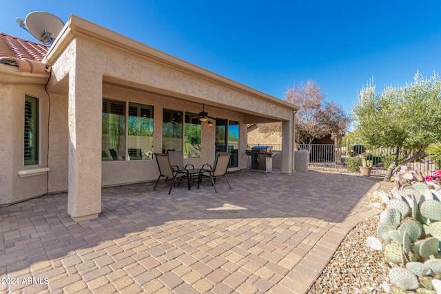 view of patio / terrace with ceiling fan and grilling area