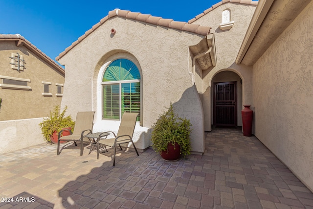 doorway to property featuring a patio