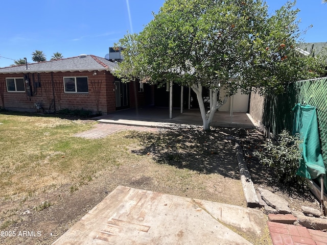 view of yard featuring a patio and a fenced backyard