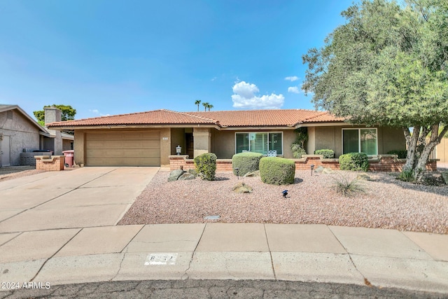 8532 E San Bruno Dr, Scottsdale, AZ 85258 - ranch-style home featuring stucco siding, an attached garage, concrete driveway, and a tile roof