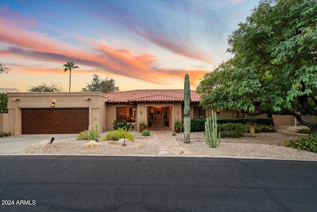 southwest-style home with a garage