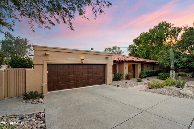 southwest-style home with a garage