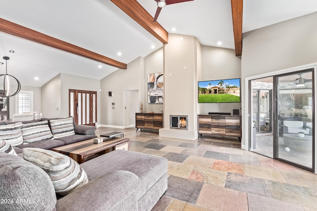 10658 E Cinnabar Ave, Scottsdale, AZ 85258 - living area featuring high vaulted ceiling, beam ceiling, a fireplace, stone tile floors, and baseboards