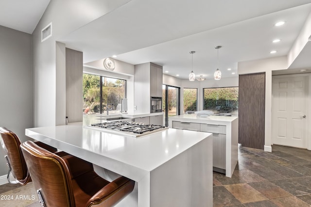 10658 E Cinnabar Ave, Scottsdale, AZ 85258 - kitchen with recessed lighting, light countertops, stone tile floors, and stainless steel gas stovetop