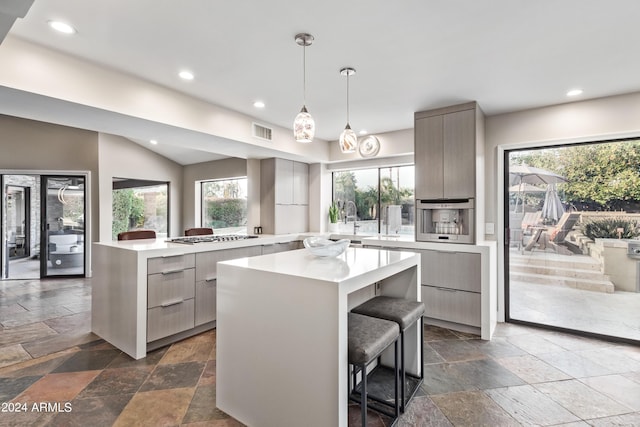 10658 E Cinnabar Ave, Scottsdale, AZ 85258 - kitchen with light countertops, modern cabinets, stone tile floors, and visible vents