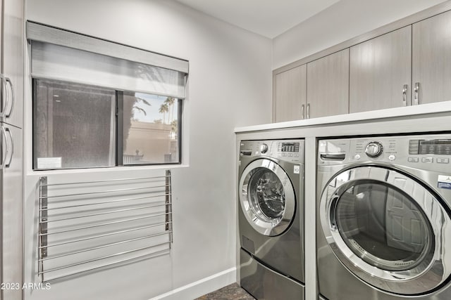 10658 E Cinnabar Ave, Scottsdale, AZ 85258 - laundry room featuring washing machine and dryer, cabinet space, and baseboards