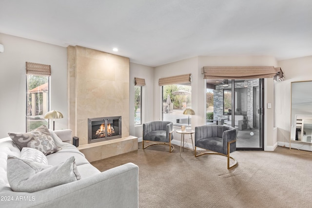 10658 E Cinnabar Ave, Scottsdale, AZ 85258 - carpeted living room featuring baseboards, a tiled fireplace, and recessed lighting