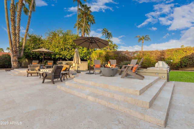 10658 E Cinnabar Ave, Scottsdale, AZ 85258 - view of patio / terrace with a fire pit