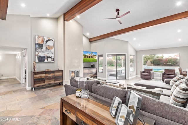 10658 E Cinnabar Ave, Scottsdale, AZ 85258 - living area with baseboards, beamed ceiling, high vaulted ceiling, and stone tile flooring