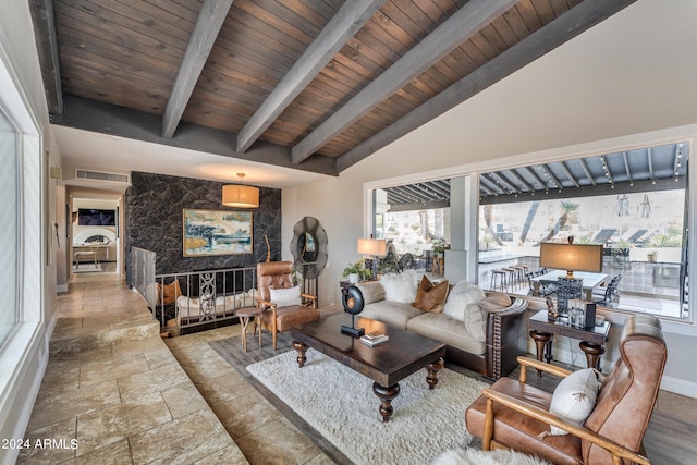 living room with lofted ceiling with beams and wooden ceiling