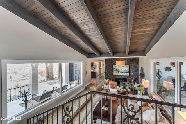 corridor featuring lofted ceiling with beams and wooden ceiling