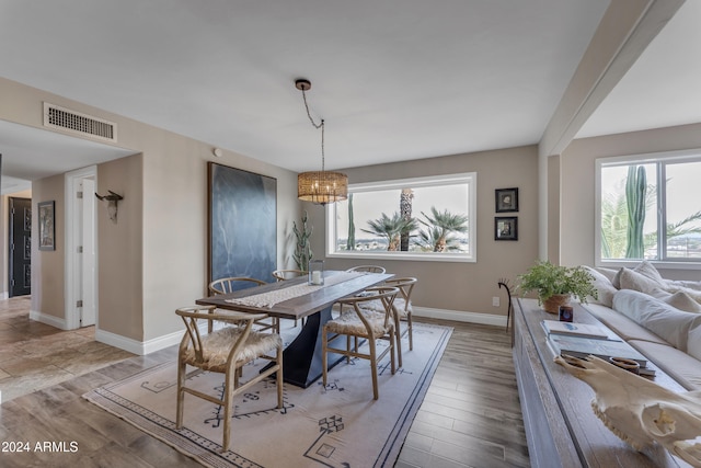 dining area featuring a chandelier and light hardwood / wood-style floors