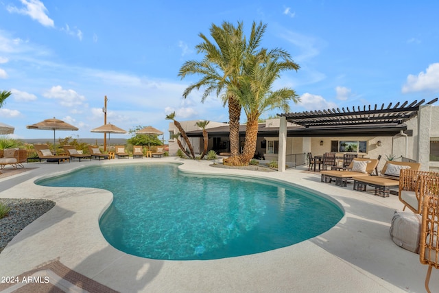 view of pool featuring outdoor lounge area, a patio, and a pergola