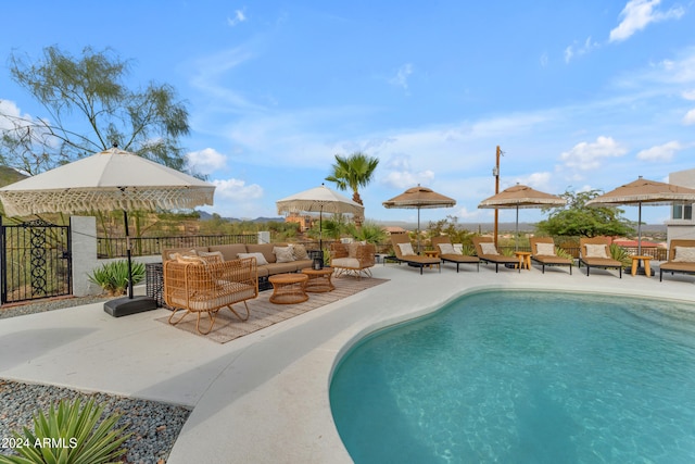 view of pool featuring an outdoor living space and a patio