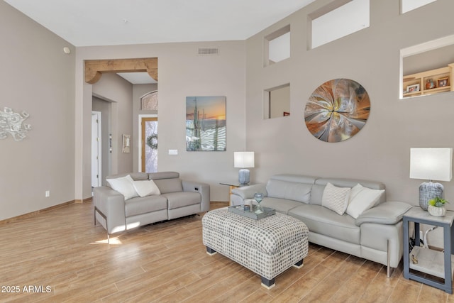 living room with light hardwood / wood-style flooring