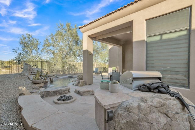 view of patio with a grill