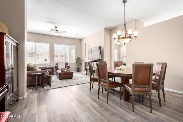 1333 W Deer Creek Rd, Phoenix, AZ 85045 - dining room with baseboards, ceiling fan with notable chandelier, and wood finished floors