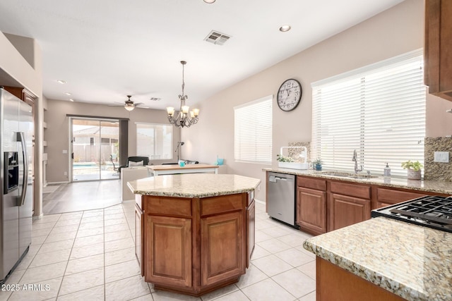 1333 W Deer Creek Rd, Phoenix, AZ 85045 - kitchen with a sink, light tile patterned floors, stainless steel appliances, and visible vents