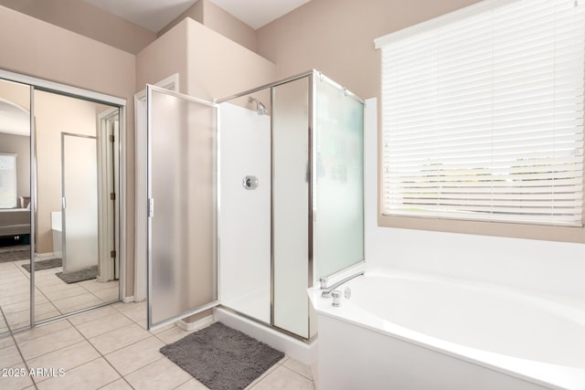 1333 W Deer Creek Rd, Phoenix, AZ 85045 - ensuite bathroom featuring a garden tub, tile patterned floors, ensuite bath, and a stall shower