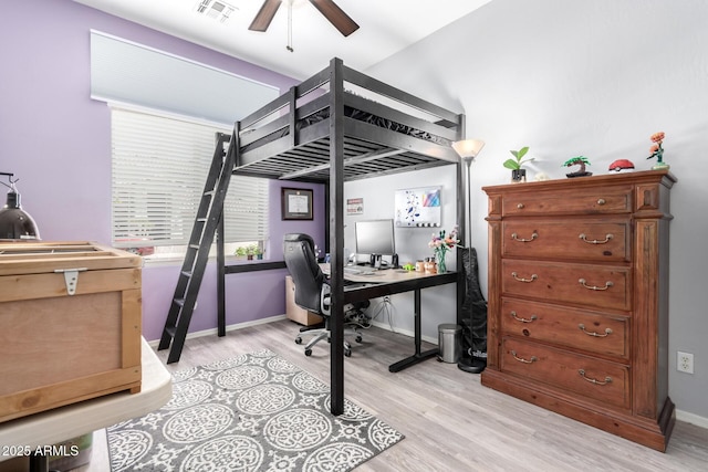1333 W Deer Creek Rd, Phoenix, AZ 85045 - bedroom featuring baseboards, light wood finished floors, and visible vents