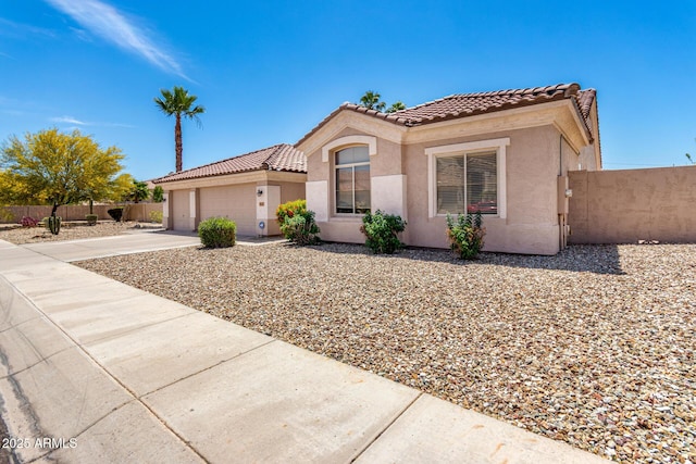 1333 W Deer Creek Rd, Phoenix, AZ 85045 - mediterranean / spanish house with a tiled roof, driveway, a garage, fence, and stucco siding