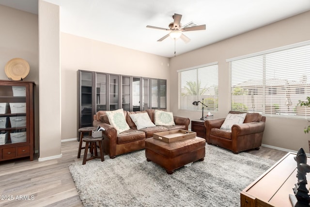 1333 W Deer Creek Rd, Phoenix, AZ 85045 - living room with baseboards, a ceiling fan, and wood finished floors