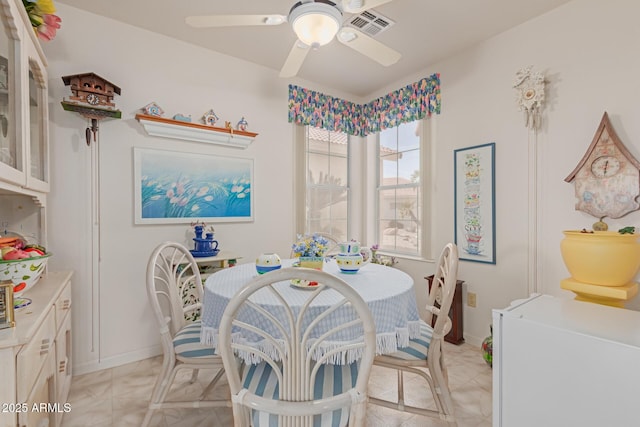 dining area with ceiling fan