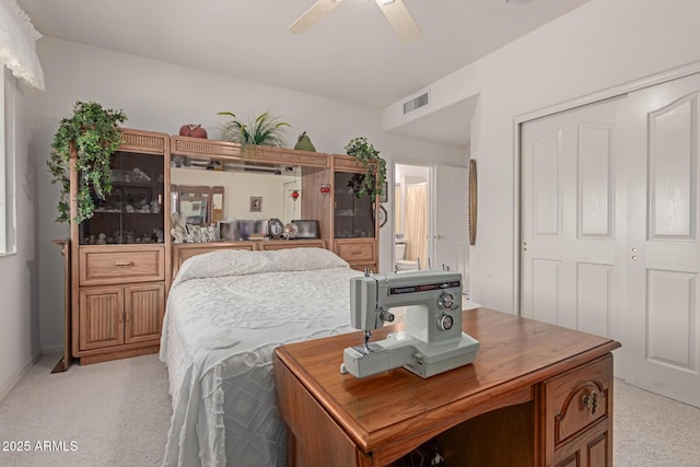 bedroom with ensuite bath, a closet, and ceiling fan