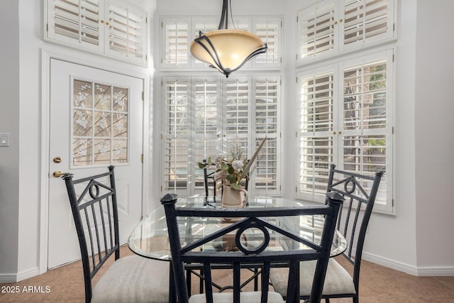 dining space with baseboards