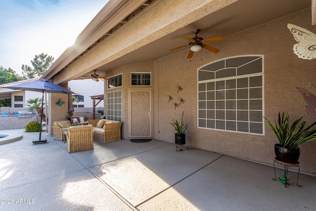 view of patio / terrace featuring a ceiling fan and an outdoor hangout area