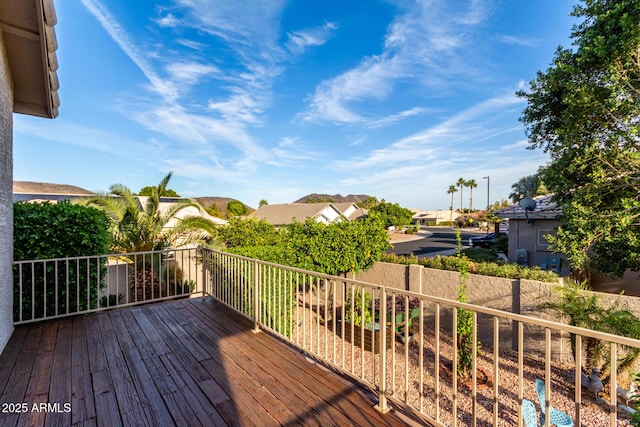 wooden deck featuring a residential view