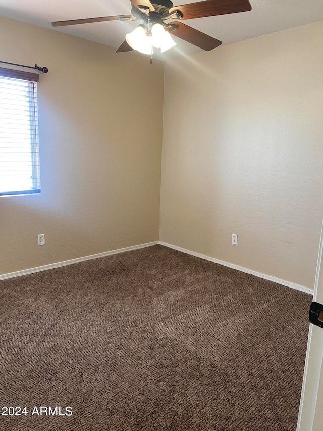 carpeted empty room with ceiling fan