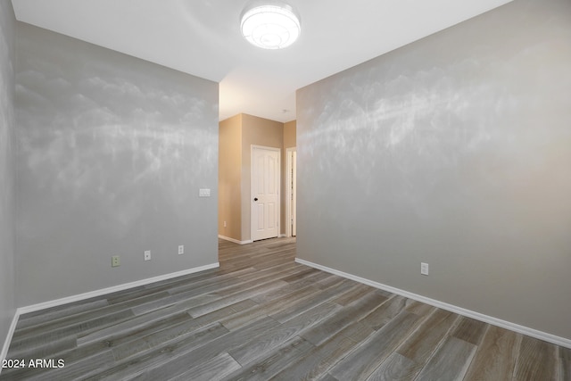 spare room featuring dark hardwood / wood-style flooring