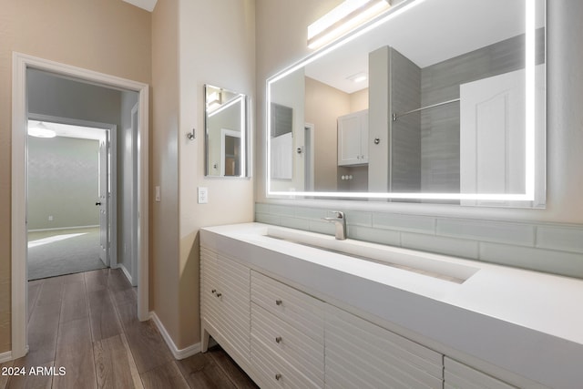 bathroom with wood-type flooring and vanity