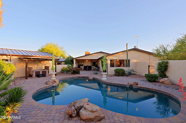 view of swimming pool featuring a patio area