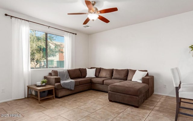 living area featuring a ceiling fan, visible vents, and light tile patterned flooring