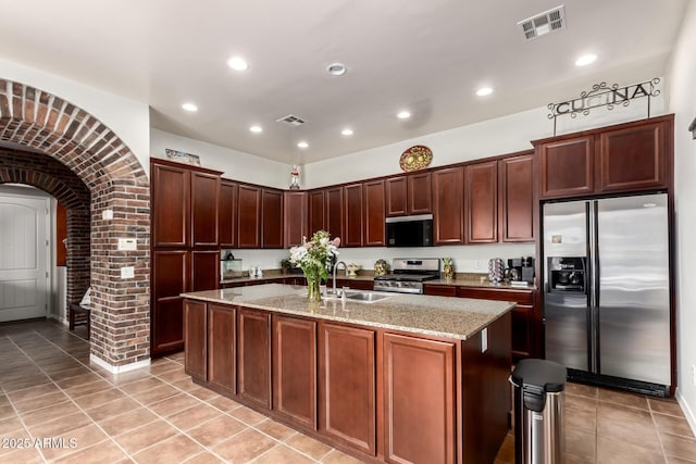 3441 S Halsted Pl, Chandler, AZ 85286 - kitchen with appliances with stainless steel finishes, a sink, light tile patterned flooring, light stone countertops, and recessed lighting