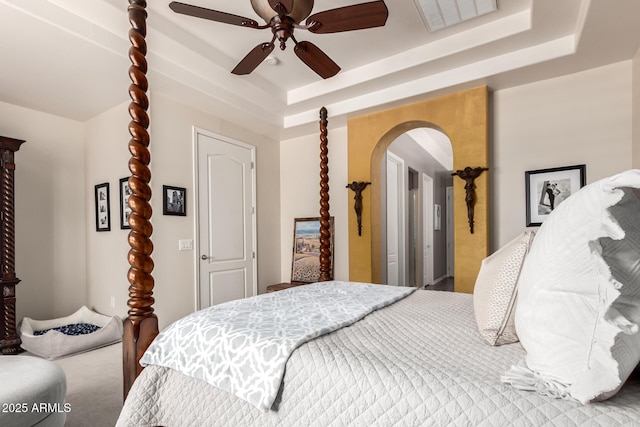 3441 S Halsted Pl, Chandler, AZ 85286 - carpeted bedroom with arched walkways, a tray ceiling, and ceiling fan