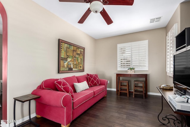 3441 S Halsted Pl, Chandler, AZ 85286 - living room with a ceiling fan, wood finished floors, baseboards, and arched walkways