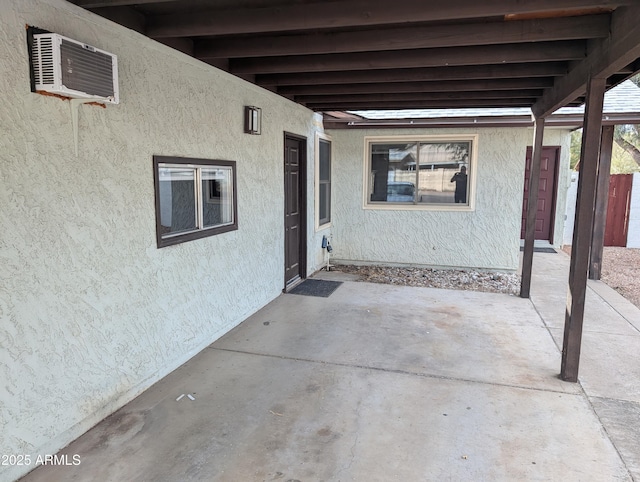 view of patio featuring a wall mounted AC