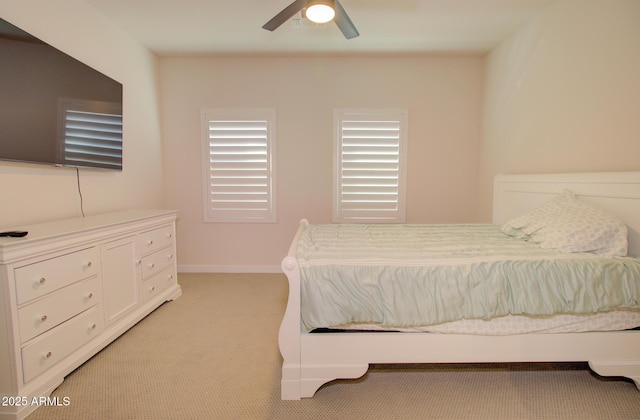 bedroom with light colored carpet and ceiling fan