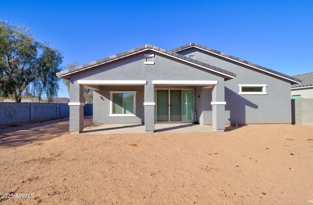 back of property with a patio area