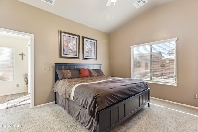 carpeted bedroom featuring lofted ceiling, baseboards, visible vents, and a ceiling fan