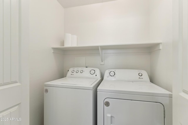 washroom featuring laundry area and washing machine and clothes dryer