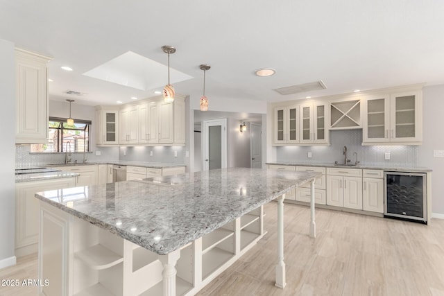 kitchen featuring open shelves, dishwasher, decorative backsplash, and wine cooler