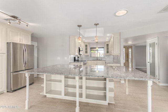 kitchen with recessed lighting, light stone countertops, a breakfast bar, open shelves, and appliances with stainless steel finishes