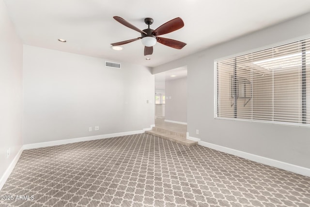 spare room with recessed lighting, ceiling fan, visible vents, baseboards, and carpet floors